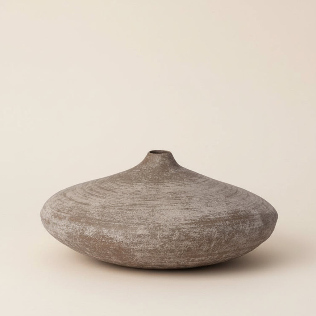 Textured brown vase on a white background